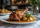 Anties "confit" patiekta su bulvių koše ir daržovėmis